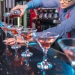 Photo Of Man Pouring Liqueur On Glass