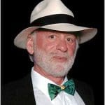 Professional portrait of Leonard Frieling in a tropical tuxedo and a Panama Hat. They're all made in the Ecuador.