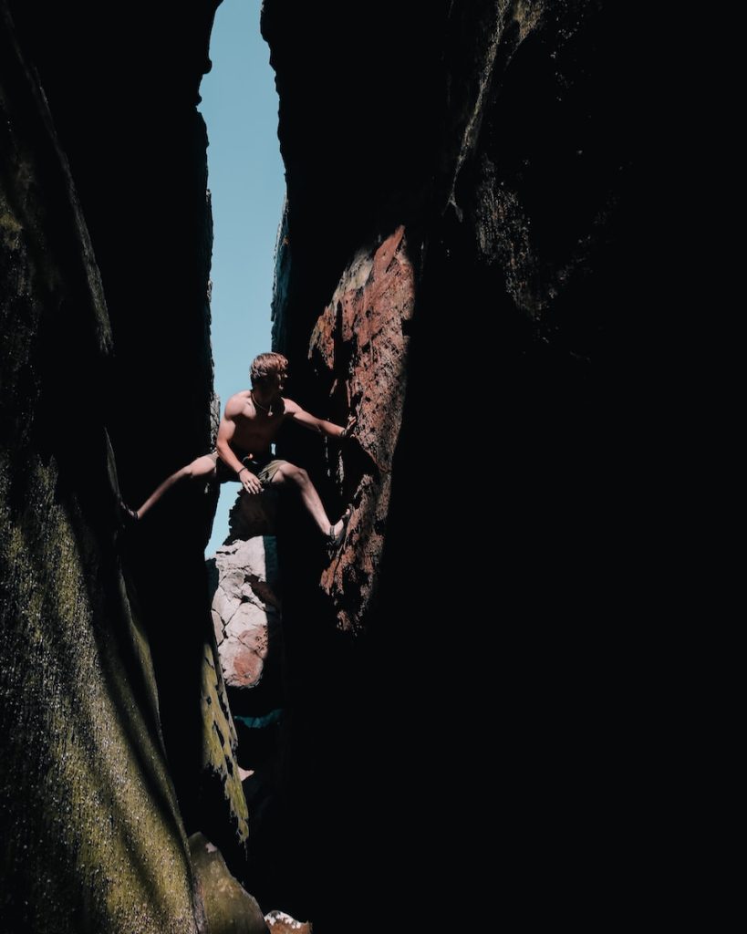 rule of thirds photography of man climbing mountain