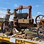 antique working steam powered log splitter at the yearly Yesteryears Farm Show on 287 in Boulder County