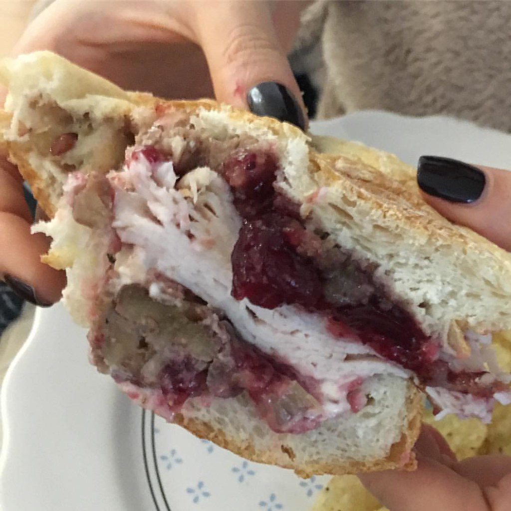 My favorite thing about is feasting on the leftovers. So why not skip to the end. A delicious sandwich made with sliced turkey, stuffing and cranberry sauce, on a fresh buttered Portuguese roll!