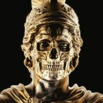 a golden statue of a roman soldier