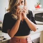 Woman Wearing Black Top Holding White Cup